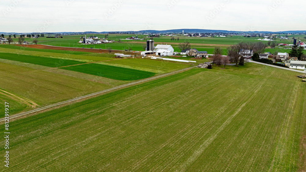 Dawn breaks over a peaceful farmland, highlighting the vibrant greens and tranquil scenery. Dawn breaks over a peaceful farmland, highlighting the vibrant greens and tranquil scenery.