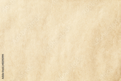 Brown crumpled paper with grains texture closeup