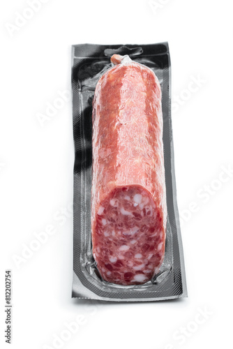 Sausage in plastic vacuum pack on white