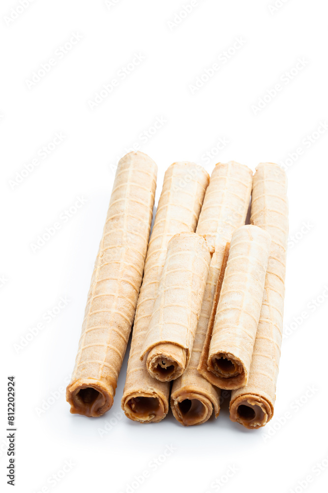 Delicious of waffer rolls with boiled condensed milk isolated on white background Delicious of waffer rolls with boiled condensed milk isolated on white background
