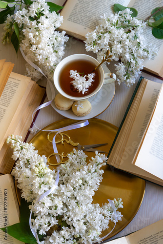 Cup of tea, bouquet of lilacs, spring still life.