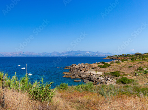 Paradise sea bay with azure water and beach view from coastline trail of Zingaro Nature Reserve Park