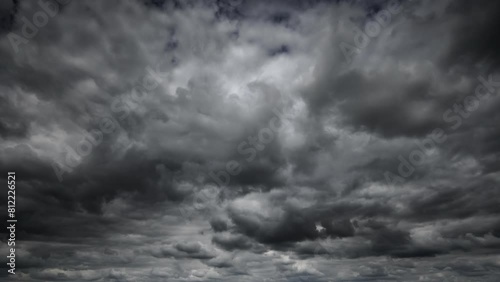 stormy sky timelapse, dark dramatic clouds, thunderstorm, rain and wind, extreme weather, abstract background
