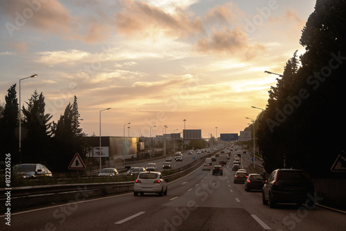 Vehicle traffic at the end of the day with the sunset on the horizon on the inner beltway, VCI, Porto, Portugal.