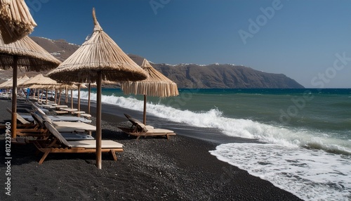 santorini island greece waves on the perissa beach with black volcanic sand photo