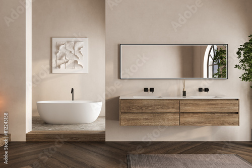 Beige bathroom interior with white basin and mirror  parquet floor  bathtub  plants. Bathing accessories and window in hotel studio.
