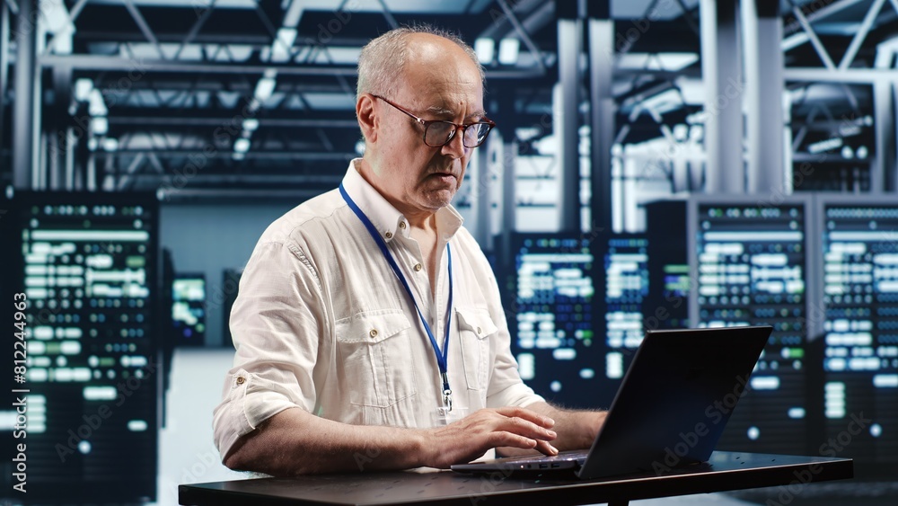 Certified technician expertly managing data while navigating in industrial server room. Professional ensuring optimal cybersecurity protection, optimizing systems and performing necessary updates Certified technician expertly managing data while navigating in industrial server room. Professional ensuring optimal cybersecurity protection, optimizing systems and performing necessary updates