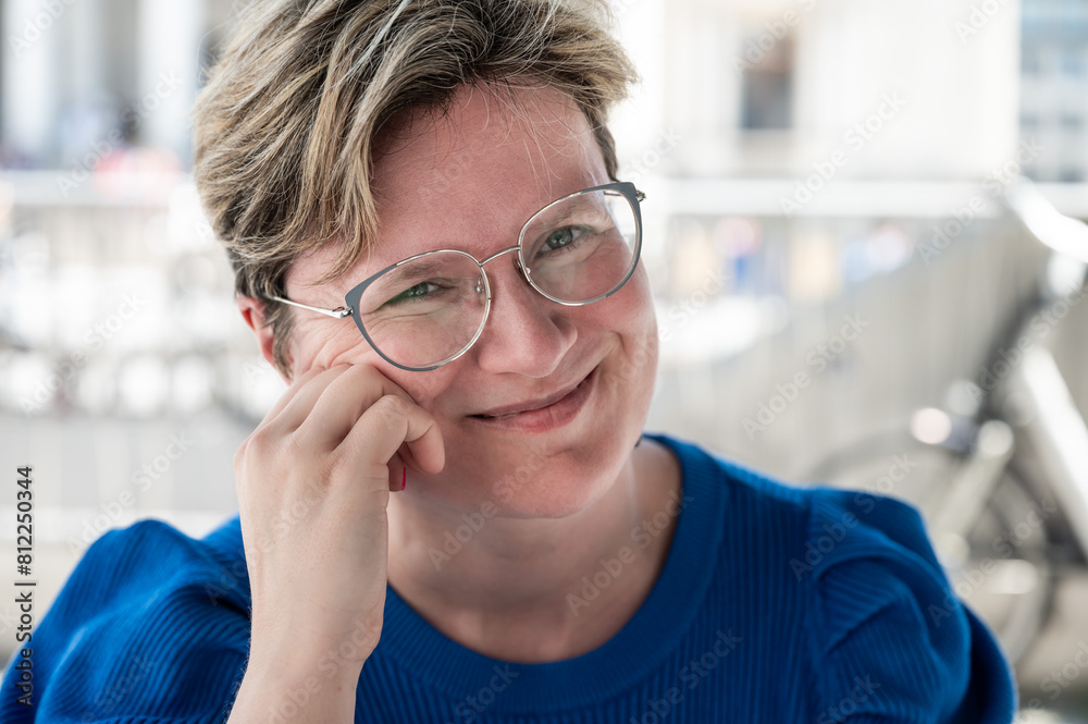 Portrait of an 38 yo white woman wearing glasses and a blue shirt, Belgium Portrait of an 38 yo white woman wearing glasses and a blue shirt, Belgium