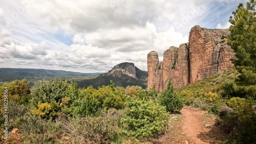 a view of Mallos de Riglos rock formations, comarca of Hoya de Huesca, province of Huesca, Aragon, Spain photo