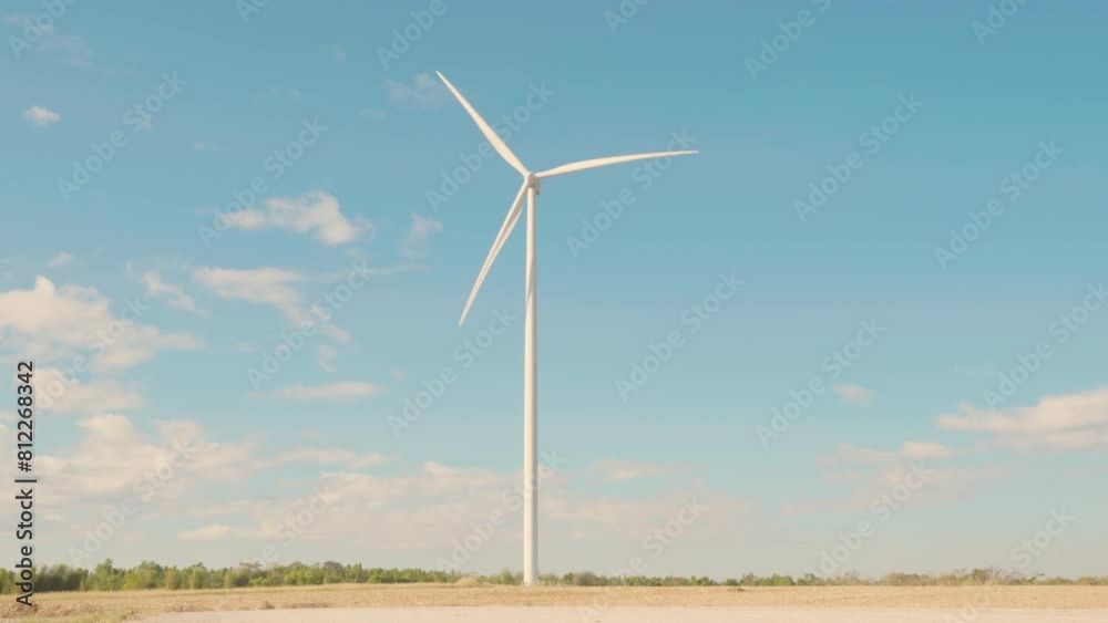 A windmill farm on a mountain captures nature's wind generating clean energy. Innovative turbines against a blue sky symbolize sustainable development. A windmill farm on a mountain captures nature's wind generating clean energy. Innovative turbines against a blue sky symbolize sustainable development.