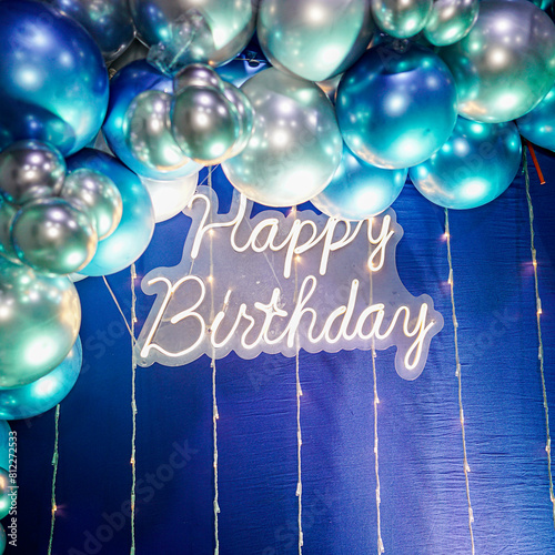 happy birthday, decoration with blue background and metallic balloons