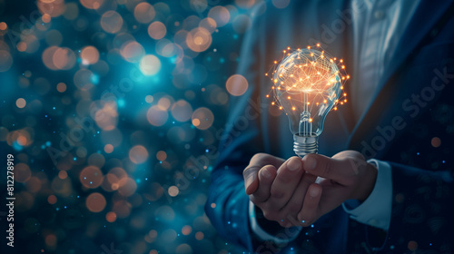 
Businessman holding half of virtual lightbulb and brain on blue bokeh background , Smart thinking idea and inspiration innovation concept. photo