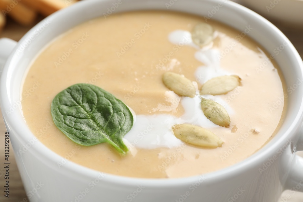 Healthy cream soup high in vegetable fats in bowl, closeup Healthy cream soup high in vegetable fats in bowl, closeup