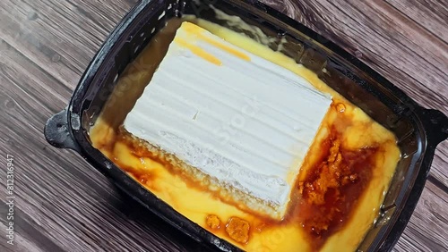 Brulee Trinity burnt cream, with whipped cream, and creme caramel, a dessert consisting of a rich custard base topped with a layer of hardened caramelized sugar. It is normally served slightly chilled photo