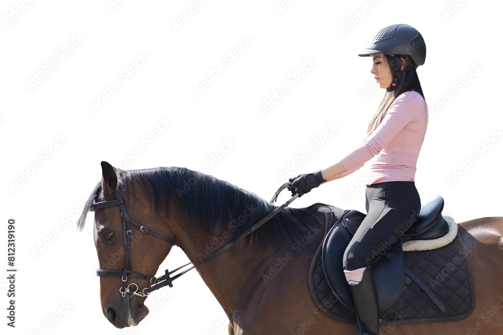 Obraz premium Close up of a young woman riding a horse in an equestrian center, while taking riding lessons