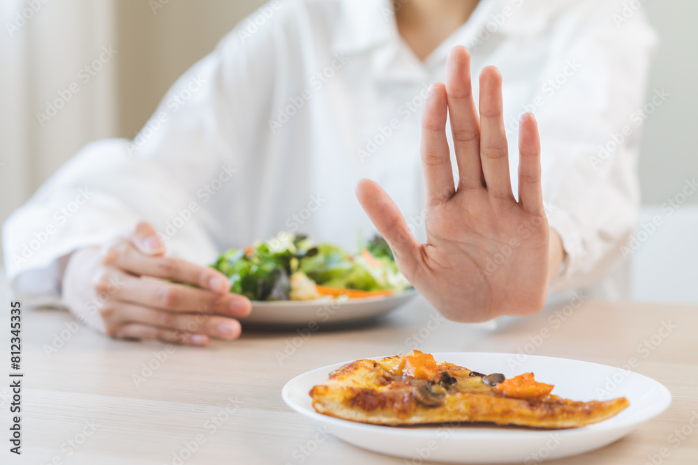 Diet concept, asian young woman close up hand push out away Pizza ...