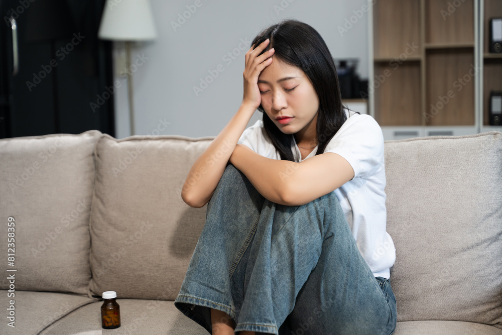 woman sit Depression Dark haired pensive glance Standing by window on sofa and anxiety woman sit Depression Dark haired pensive glance Standing by window on sofa and anxiety