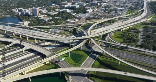 View from above of USA transportation infrastructure. American freeway intersection with fast driving cars and trucks in Tampa, Florida. photo