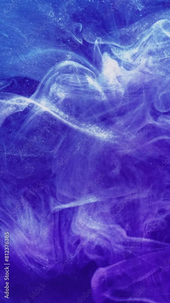 Vertical video. Glitter mist. Ink water. Purple blue pink color sparkling vapor wave texture spreading swirl motion abstract art background. Vertical video. Glitter mist. Ink water. Purple blue pink color sparkling vapor wave texture spreading swirl motion abstract art background.