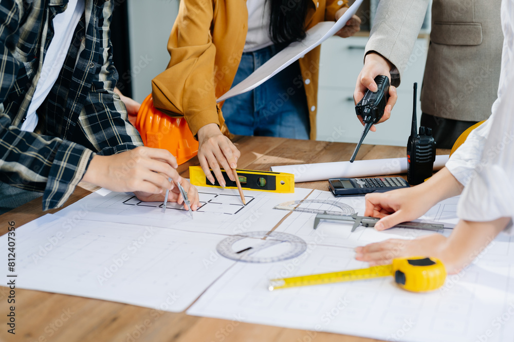 Engineer Teamwork Meeting, Drawing working on blueprint meeting for project working with partner on model building Engineer Teamwork Meeting, Drawing working on blueprint meeting for project working with partner on model building