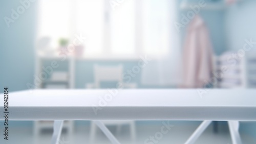 A white table with a white clean tablecloth in a laundry room with table cloth and blurring background. Interior mockup with copy space for design and advertisement. Equipment. Copy space. AIG35.