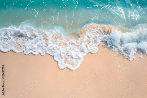 Beautiful sandy beach and soft blue ocean wave © Areesha