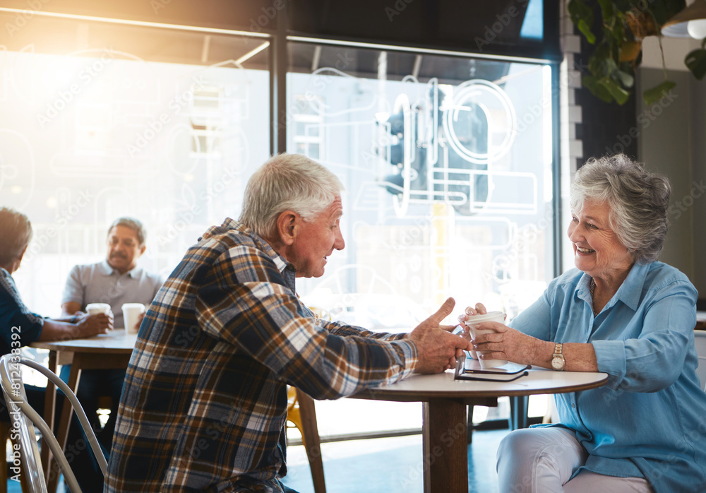 Obraz premium Senior couple, talking and happy in cafe for date with conversation, drinking tea or communication. Elderly, people and discussion in coffee shop with smile for bonding, retirement or relax with care