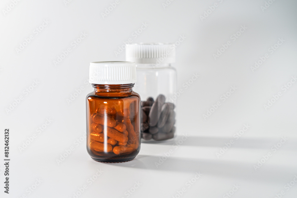 several bottles containing pills and capsules several bottles containing pills and capsules
