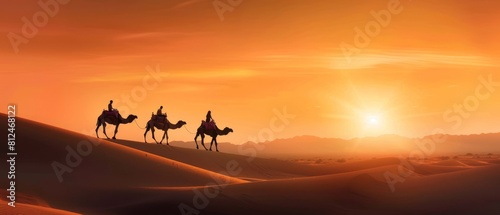 Fiery Sunset Over Camel Caravan in Desert.