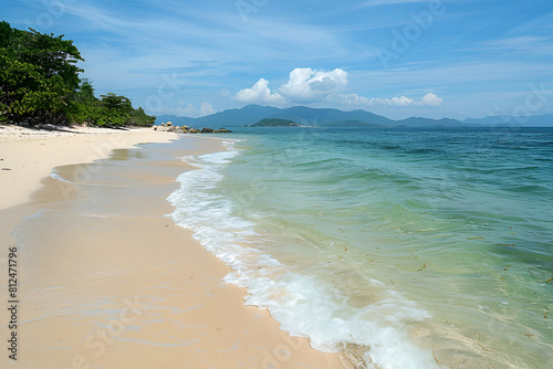 Sandy tropical beach with island on background © Areesha