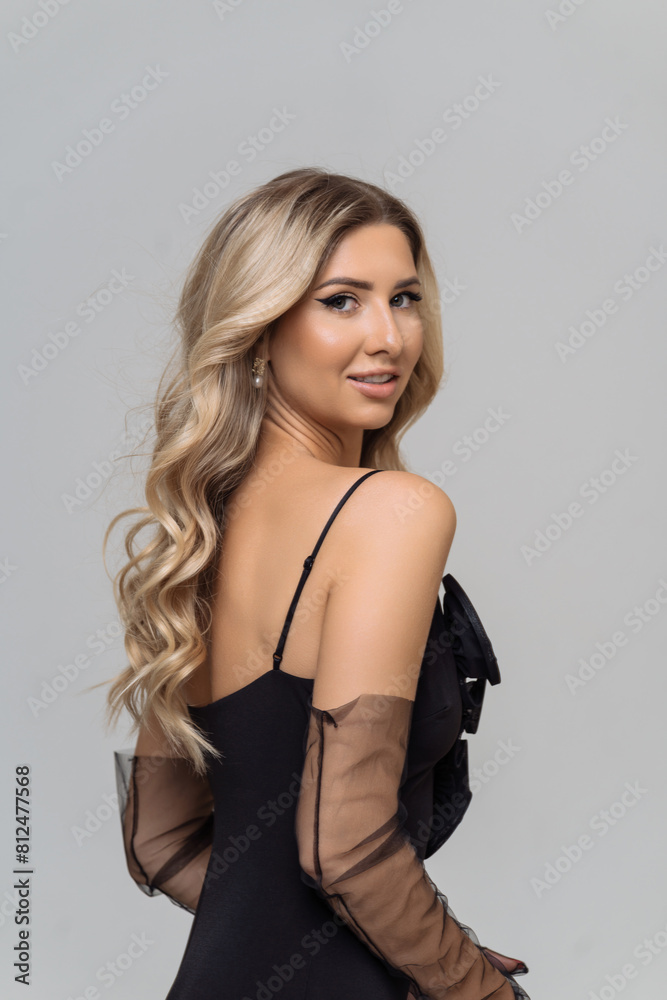 Beautiful sensual woman in a black dress