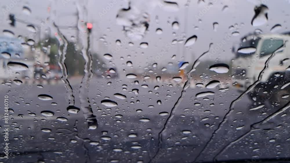 Rain Drops Falling down on background mirror car view, High quality photo of Rain on Window Sky Drops, Close up Slow Rain, Rainy day, Heavy Rainfall. Raining in car traffic. Rain Drops Falling down on background mirror car view, High quality photo of Rain on Window Sky Drops, Close up Slow Rain, Rainy day, Heavy Rainfall. Raining in car traffic.