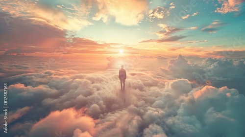 A figure stands in the foreground with their back to the viewer, overlooking a breathtaking vista of clouds basked in the warm glow of a setting sun. The vista is a sea of fluffy white cumulus clouds,
