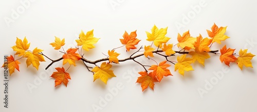 An artificial maple branch with lifelike leaves creating a stunning visual effect for any space Perfect for arranging decorative settings or creating a captivating copy space image