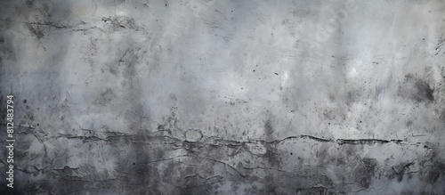 A grunge gray concrete wall with an abstract texture suitable for use as a background image with copy space