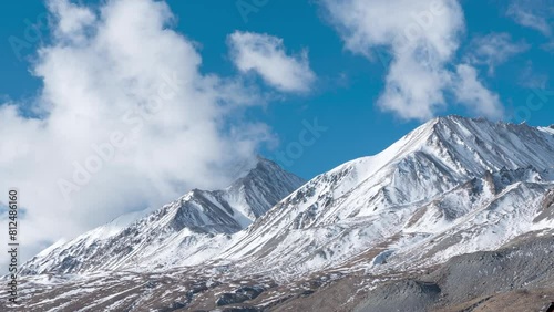 Time lapse of clouds and Kangju Kangri, elevation 22,064, a snow-capped mountain in the Himalayas in northern India near the Tibet border