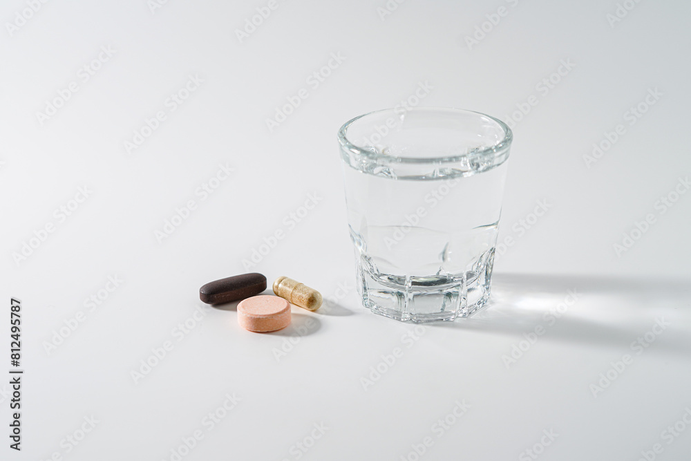 Pills and glass of water Pills and glass of water