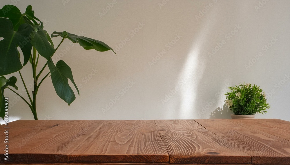 Real wood table top texture on white wall room background.For create product display or key visual layout Real wood table top texture on white wall room background.For create product display or key visual layout