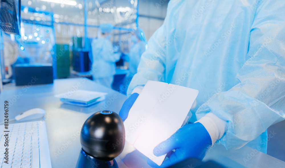 Worker use barcode scanner for marking surgery kit box of production med factory Worker use barcode scanner for marking surgery kit box of production med factory