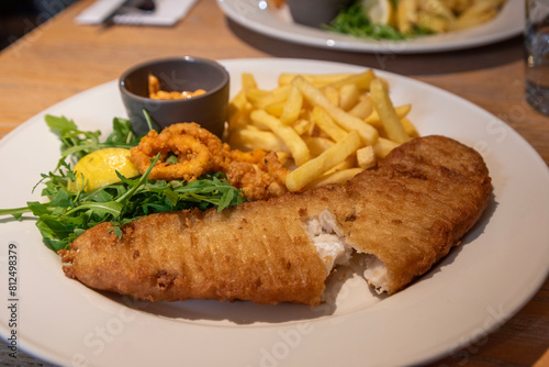 Fried fish and chips and a side salad are a common breakfast meal at the restaurant.