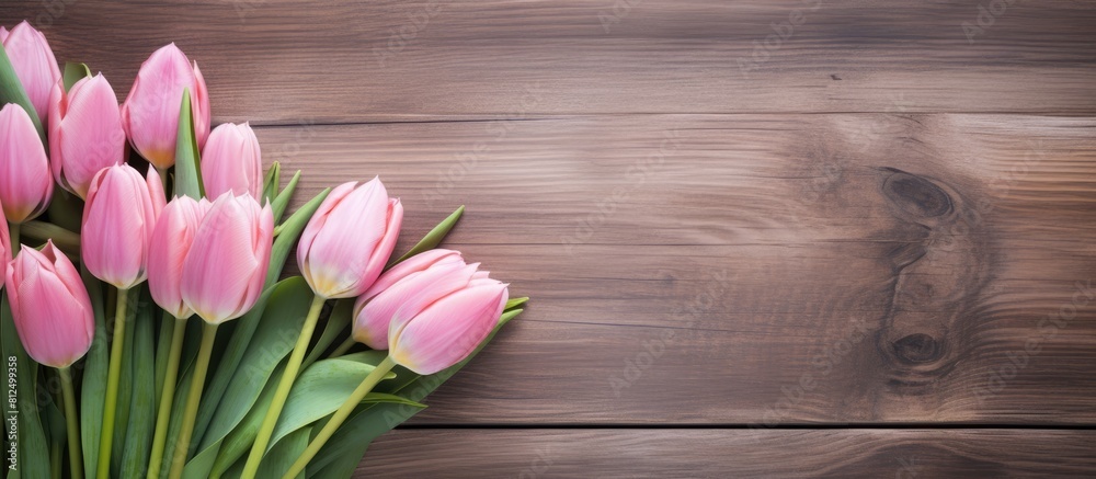 Copy space image of pink tulips displayed against a rustic wooden backdrop Copy space image of pink tulips displayed against a rustic wooden backdrop