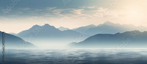 A misty sunrise over the ocean with fog obscuring the view. Creative banner. Copyspace image photo