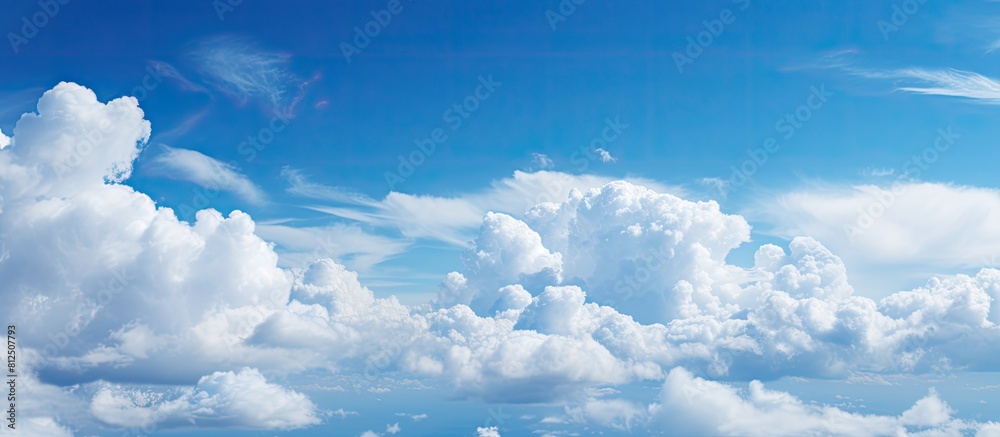 A stunning sky adorned with fluffy white clouds offers an ideal backdrop for a copy space image A stunning sky adorned with fluffy white clouds offers an ideal backdrop for a copy space image
