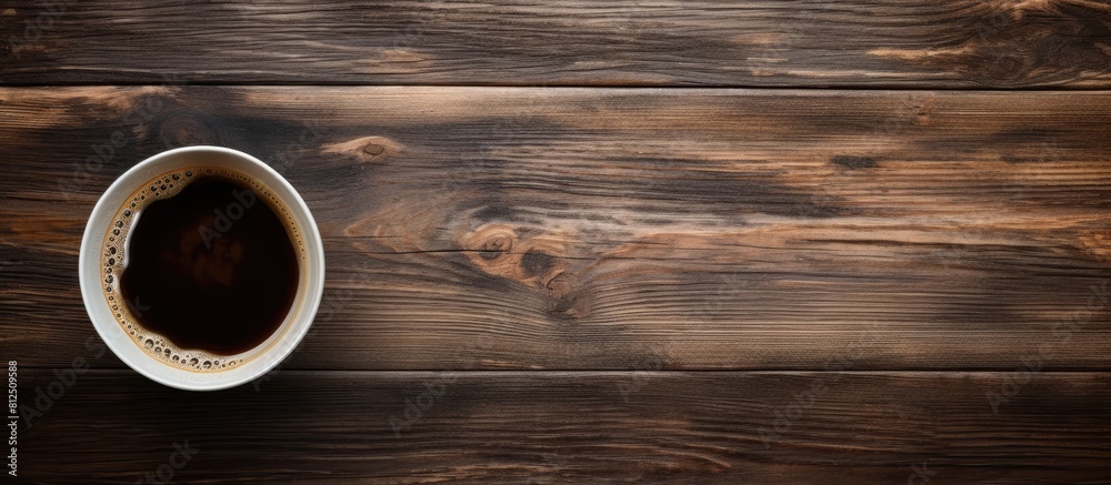 A top down perspective showing an old wooden surface with a cup of black coffee perfect for a copy space image 108 characters A top down perspective showing an old wooden surface with a cup of black coffee perfect for a copy space image 108 characters