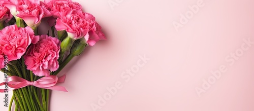 Wallpaper Mural A top down view of a holiday greeting gift with a bouquet of carnations on a bright pink table serves as a Mother s Day background Copy space image Torontodigital.ca