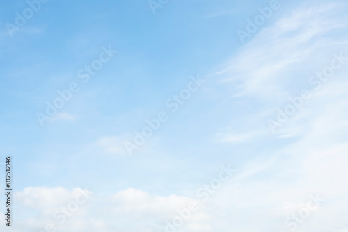 Sky with white clouds in a soft pastel image.