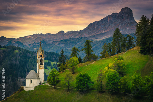 Chapel of St Barbara at sunset in Dolomites, Italy