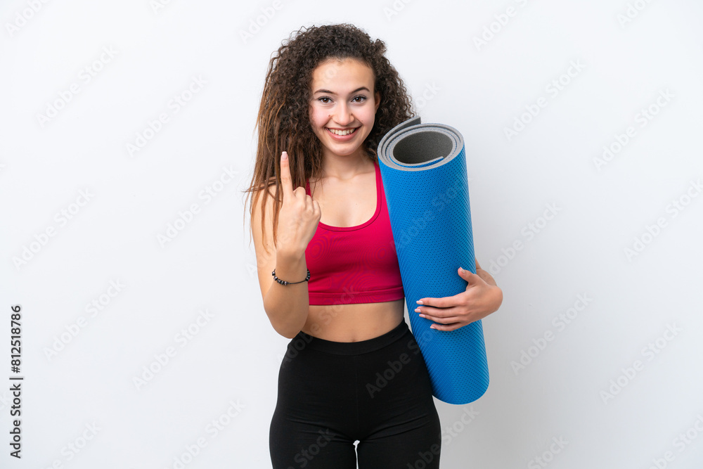 Young sport Arab woman going to yoga classes while holding a mat isolated on white background doing coming gesture Young sport Arab woman going to yoga classes while holding a mat isolated on white background doing coming gesture