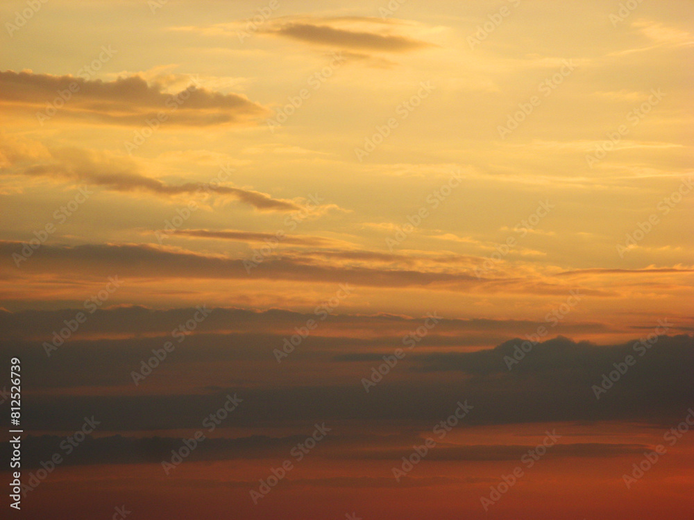 Sunset sky with dark clouds and golden sky and clouds