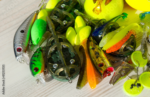 Fishing tackle on a wooden background.